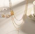 Gold layered chain necklace. 