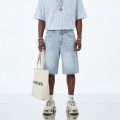 Men's and women's blue ripped jeans trendy American loose straight leg non stretch casual shorts suitable for summer street wear. 