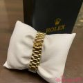 Rolax watch golden colour. 
