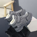 A pair of children's winter velvet warm snow boots with leather waterproof and anti-slip wear-resistant high-top cotton shoes. 