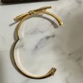 (C). Kate Spade Bow Bangle Bracelet. 
