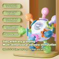 Baby Manhattan Grasping Ball - 3-in-1 Teether, Rattle, and Soft Rubber Grasping Toy for Early Education and Teething Relief.