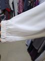 White abaya with different styles. 
