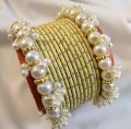 Trendy bangles set with pearl bangles golden dotted pearl bangles set bangles for girls in all sizes and colors gajra bangles set. 