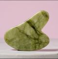 Natural Gua Sha stone for skincare routine. 