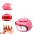 Portable mini UV light nail dryer. 