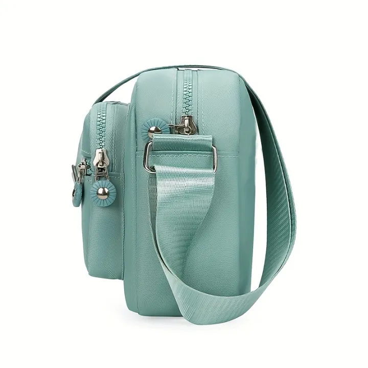 Lightweight%20Nylon%20Chic%20Crossbody%20Bag%20for%20Women%20-%20Adjustable%20Strap,%20Zip%20Closure,%20Tassel%20Accent,%20Solid%20Color%20-%20Image%204