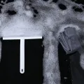 Goody home thermoplastic rubber squeegee cleaning glass windshield. 