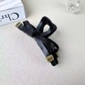 1/2 PC 2026 Y2K ladies' new street style elegant gold label black leather butterfly knot large-sized matte clutch hair accessory. 