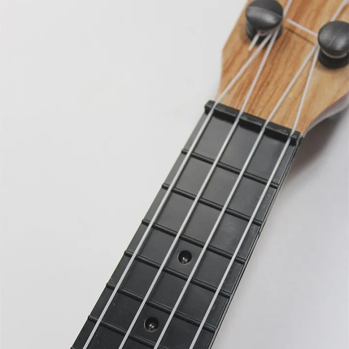 Mini%20Guitar%204%20Strings%20Classical%20Ukulele%20Guitar%20Toy%20Musical%20Instruments%20For%20Kids%20Beginners%20Early%20Education%20Ukulele%20-%20Image%205