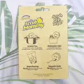 Free dual-sided scrubber + sponge (Scrub Daddy®) White smile face sponge. 