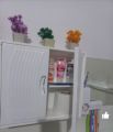 Plastic storage box cabinet double door for bathroom storage space saver. 