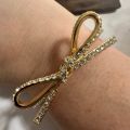 (C). Kate Spade Bow Bangle Bracelet. 