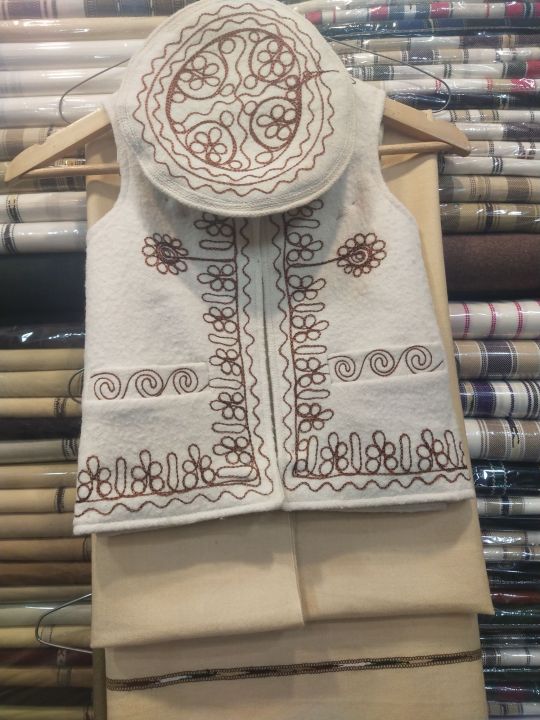 a woolen waistcoat and pakool for