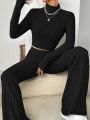 Stand Collar Navel T-shirt and Trumpet pants.