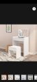 Modern dressing table with mirror of stool. 