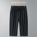 Men's Ice Silk Seven-Quarter Pants 2025 Summer Thin Riding Breeches Loose-Fit Quick-Drying Casual Solid Sports Mid-Waist Shorts. 