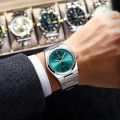 POEDAGAR 930 Men's Luxury Stainless Steel Quartz Watch – Luminous Dial with Date & Day Display. 