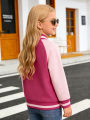 Little girl's cartoon baseball jacket with heart-shaped cat pattern, suitable for children's casual outdoor daily activities.
