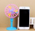 Mini toy fan floor standing for kids play. 