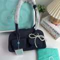 Cicelle shoulder bag oven modern denim fabric with Pearl knot pendant. 