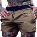 2026 Summer Gym Fitness Men's Shorts Woven Sweatpants Thin Fashion Men Marathon Running Shorts Sports Breathable Training Pants.