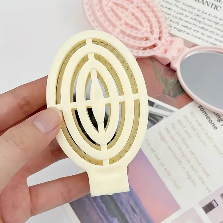 Portable%20Folding%20Hair%20Comb%20with%20Mirror,%20Lightweight%20&%20Travel-Friendly%20for%20On-the-Go%20Styling.%20A%20Perfect%20%20for%20Women%20&%20Girls.%20-%20Image%204