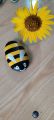 stone painting of honey bee. 