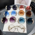 New Rimless Cut Edge Diamond Sunglasses Fashion Round Rhinestone Sunglasses Wave Design Mirror Leg Glasses. 