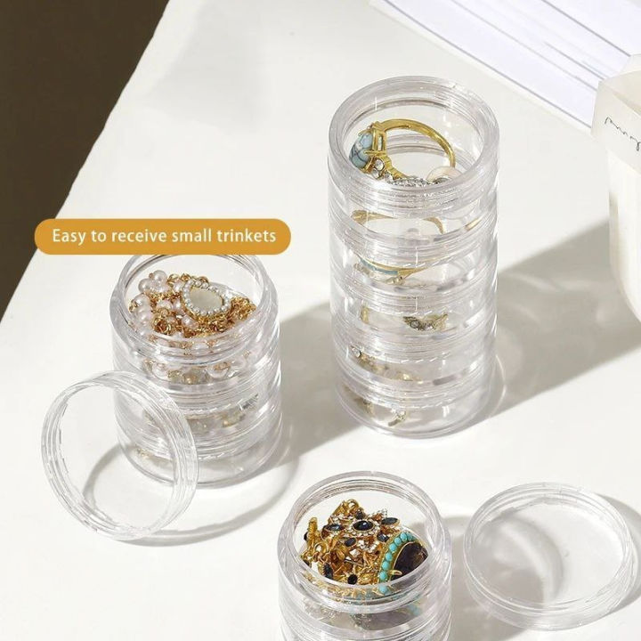 Mini%20Round%20Jewelry%20Storage%20Box%20(5%20Layer)%20%E2%80%93%20Transparent%20Acrylic%20Organizer%20for%20Rings,%20Earrings,%20Studs%20&%20Small%20Accessories%20%7C%20Compact%20360%C2%B0%20Rotating%20Jewelry%20Case%20for%20Dressing%20Table%20&%20Travel%20-%20Image%202
