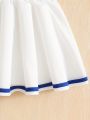 Summer girls' sporty style two-piece set with heart cartoon pattern print, pleated short skirt and short-sleeved T-shirt. 