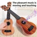 Children's toy guitar and string instrument toys, ukulele toys puzzle educational music toys stimulate children's musical talent. 