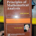 Principles of Mathematical Anaysis By Walter Rudin. 