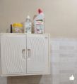 Plastic storage box cabinet double door for bathroom storage space saver. 