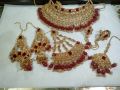 bridal first day jewellery heavy set in golden and red colour unique and stylish design. 