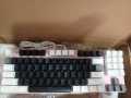 87-Key Mechanical Keyboard With Black And White Keys And Pink Backplate. 