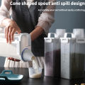 Airtight Laundry Liquid Storage Jar Portable Washing Powder Dispenser with Measuring Cup for Convenient and Efficient Laundry. 