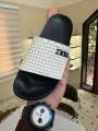 Monochrome pool slide sandals. Thick EVA sole and Liquid PVC upper.