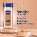 Vaseline Body Oil Intensive Care Cocoa Radiant Body Oil for Glowing skin Body Gel Oil made with Pure Cocoa Butter + Replenishing Oils 6.8 oz 200 ml. 