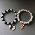 pack of 1 pair. tom and Jerry charm bracelet. /duo / friendship  / cartoon / unisex / couple bracelet. customize handmade jewelry accessories. cartoon character jewelry. 8MM glass beads black, white and brown color.. 