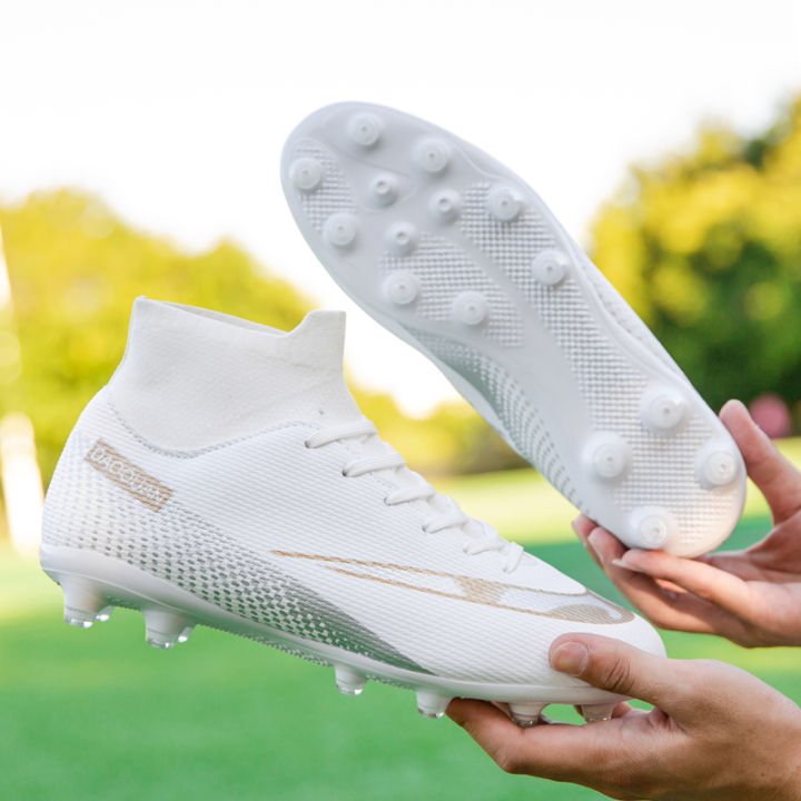 Premium%20high-top%20football%20shoes%20FG%20long%20studs%20and%20TF%20short%20studs,%20suitable%20for%20both%20men%20and%20women,%20offer%20comfort.%20Sole%20spikes%20-%20Image%207