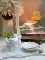 Set of 4 pc home decor set, one arch wavy tray, one shell tray, one candle holder, one lady head vase for flowers. 