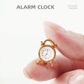 1 piece of dollhouse miniature metal alarm clock: 1/12 mini simulation bedroom scene decoration model (sticker random).