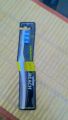Reach essential care plastic tooth brush. 
