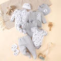 his 8-piece unisex newborn layette set fits boys and girls aged 0-9 months, with lovely grey bear prints..