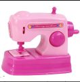 Mini sewing machine toy. 