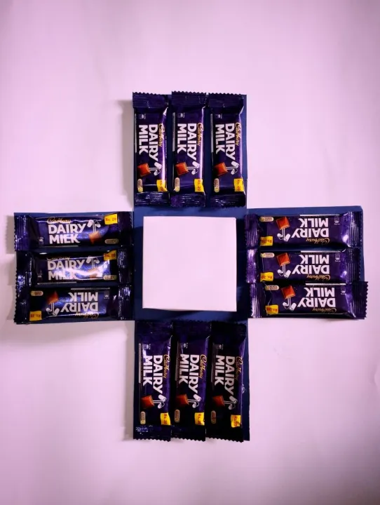 Chocolate%20Gift%20box%20with%20Cadbury%20dairy%20milk%20chocolates%20and%20Cadbury%20eclairs%20toffees%20automatic%20open%20with%20pink%20ribbon%20-%20Image%203