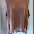 Peach oversized sleeveless body covering sweater. 