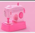 Mini sewing machine toy. 