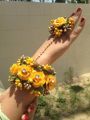 Artificial flower bridal jewellery set made with polyster fabric it includes (  earings,ring,tika,bracelet ,necklece). 